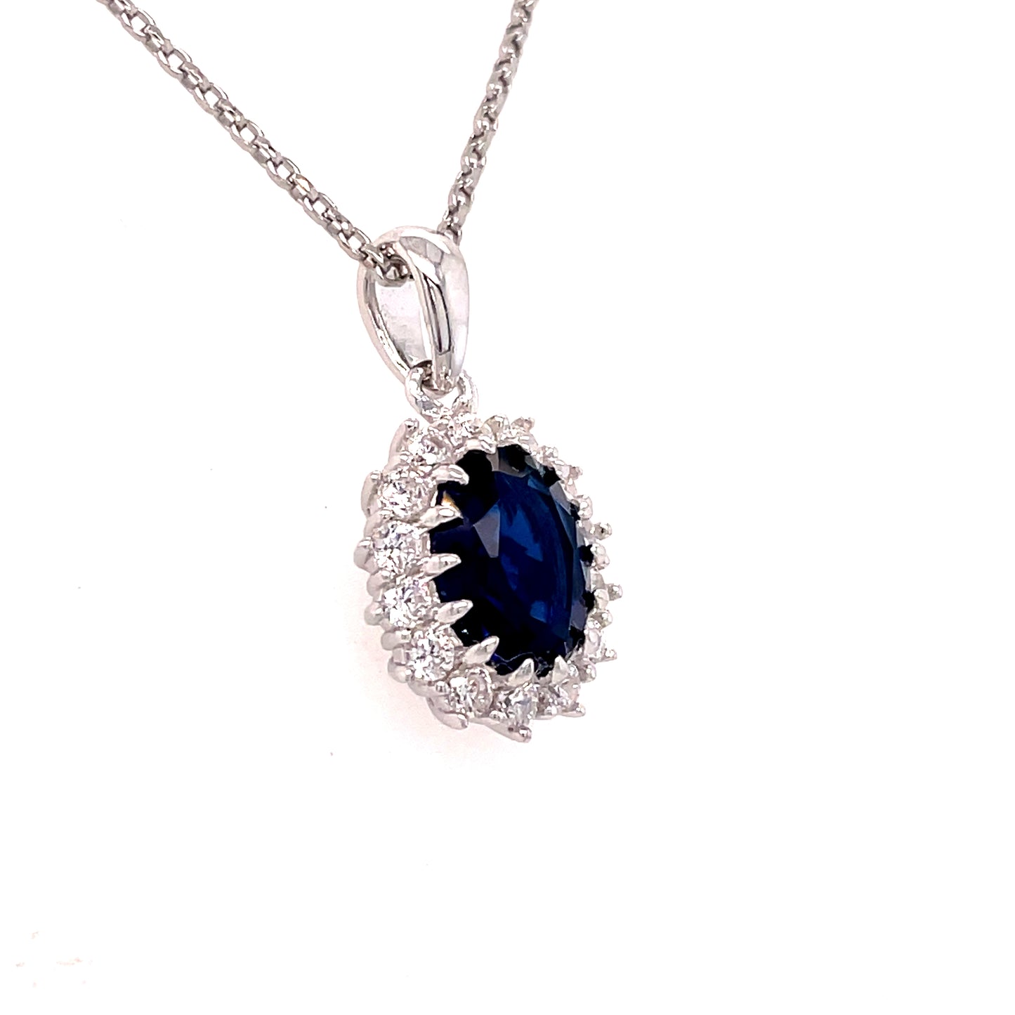 Sterling Silver Oval Blue CZ Pendant with White CZ Halo