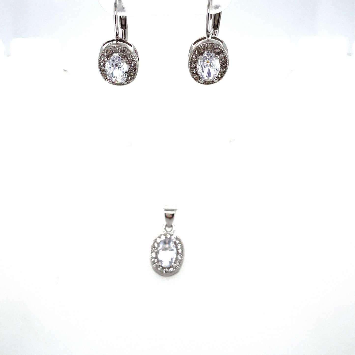 Sterling Silver Cubic Zirconia Oval Pendant And Huggie Set