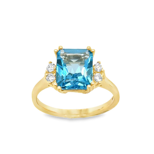 9ct Radiant Cut Blue Topaz Solitaire With Rond Brilliiant Diamond Diamond Shoulders .16ct