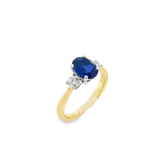 9ct Cubic Zirconia Blue Oval 3 Stone Ring With Round Shoulders
