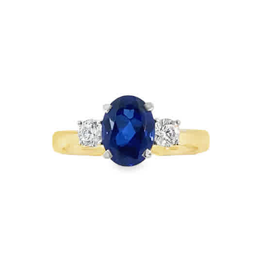 9ct Cubic Zirconia Blue Oval 3 Stone Ring With Round Shoulders