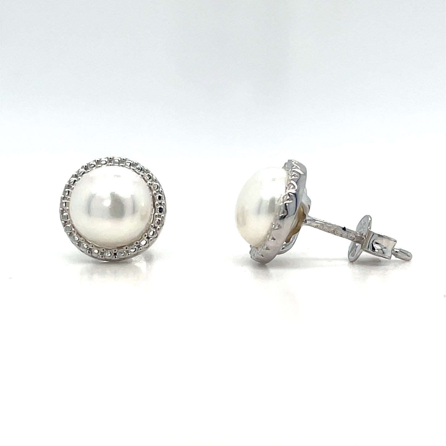 9CT WHITE GOLD FRESHWATER PEARL AND CUBIC ZIRCONIA HALO STUD EARRING