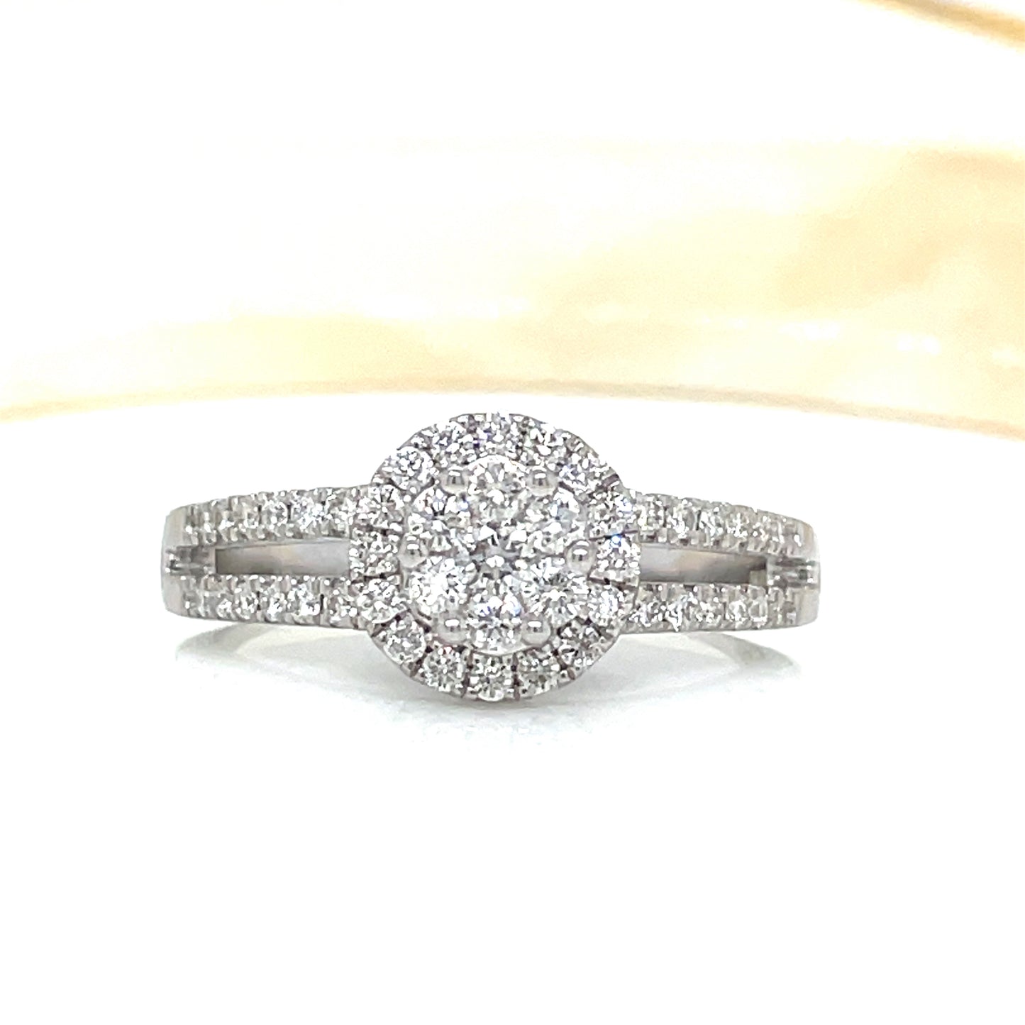 9ct white gold halo cluster with split diamond shoulders