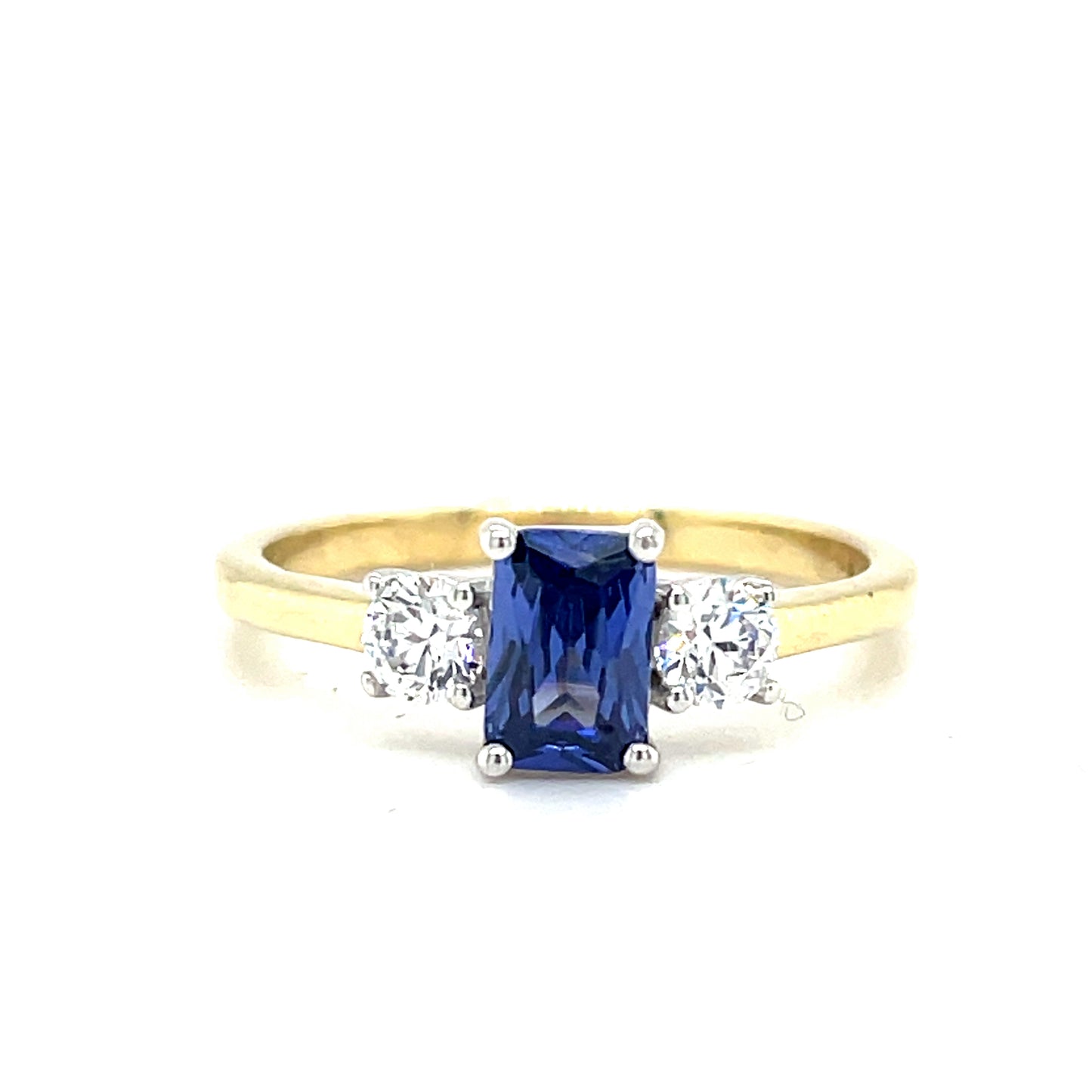 9CT Emerald Cut 3 Stone Cubic Zirconia and Blue Stone Dress Ring