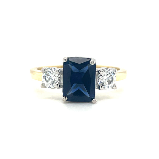 9ct Gold Emerald Cut Tanzanite Ring With Round CZ Shoulders