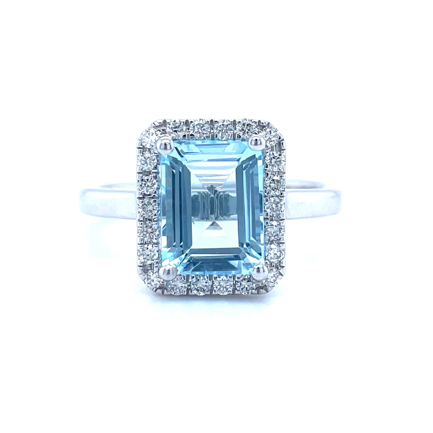 9ct White Gold Emerald Cut Halo Blue Topaz And Diamond Ring .25