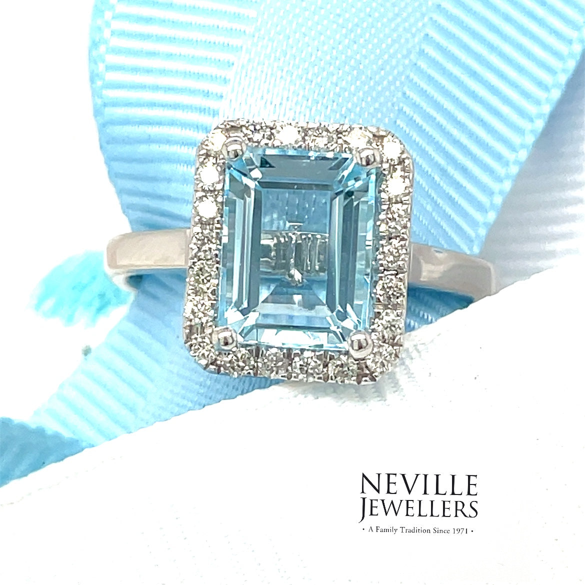 9ct White Gold Emerald Cut Halo Blue Topaz And Diamond Ring .25