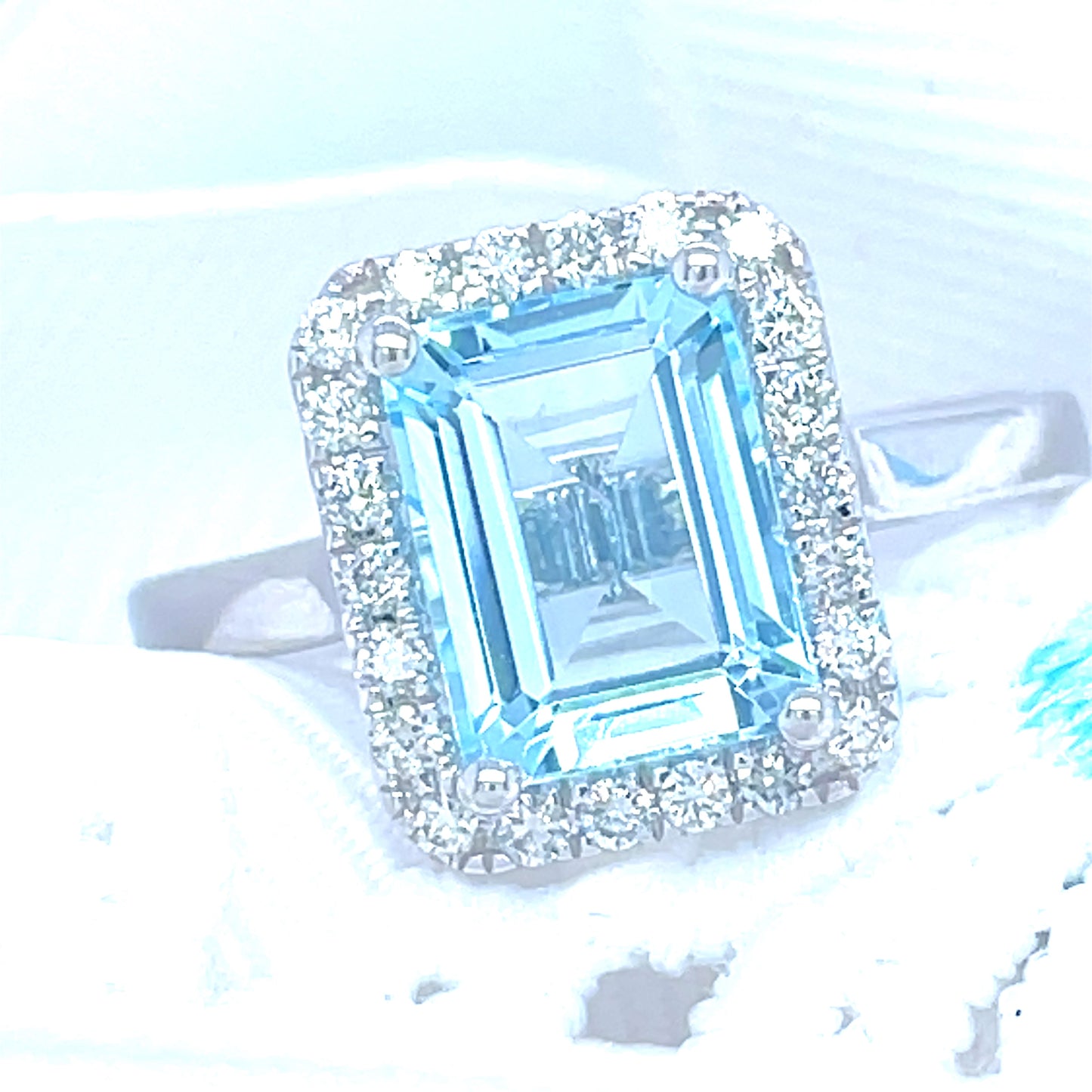 9ct White Gold Emerald Cut Halo Blue Topaz And Diamond Ring .25