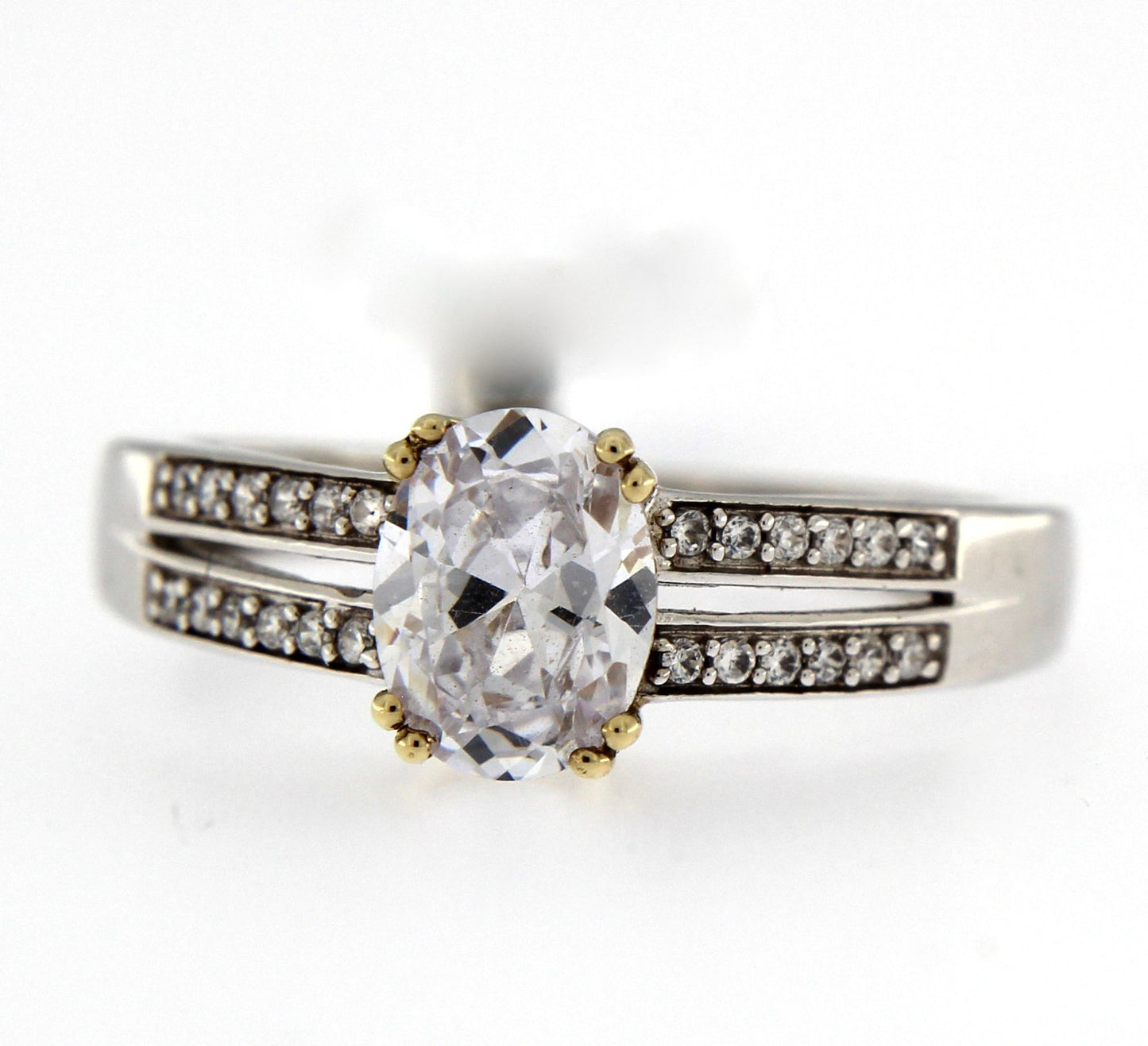 9ct White Gold Oval Solitaire CZ Ring with Yellow Gold Claws and Open Stone Set Shoulders